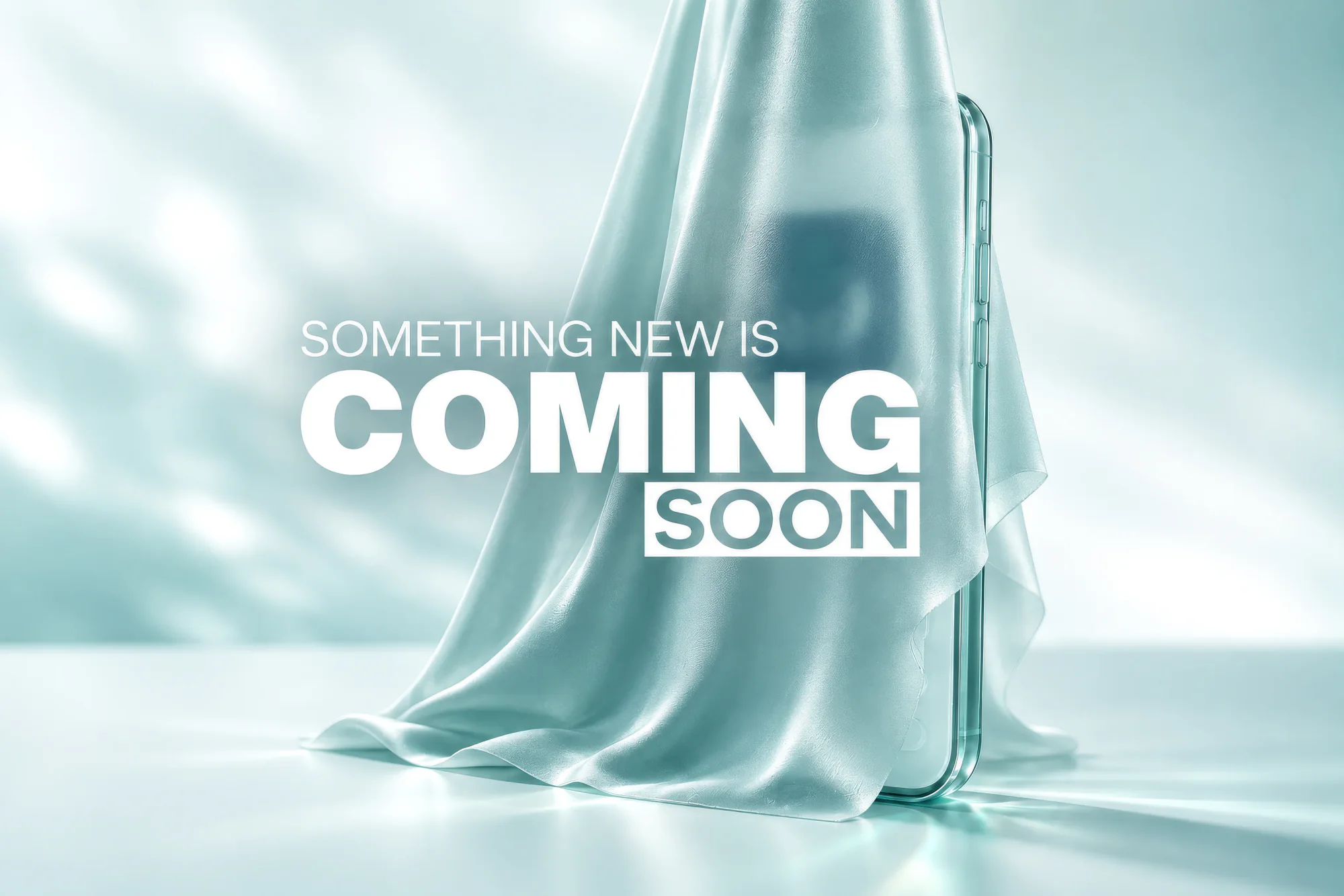 A smartphone under draped silk, captioned "Something new is coming soon"